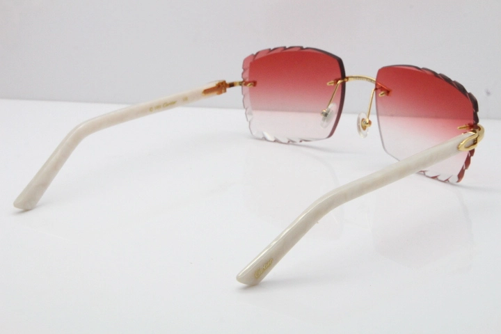 Cartier Rimless Aztec Arms 8300816 Carved Lens Sunglasses In Gold Red Lens