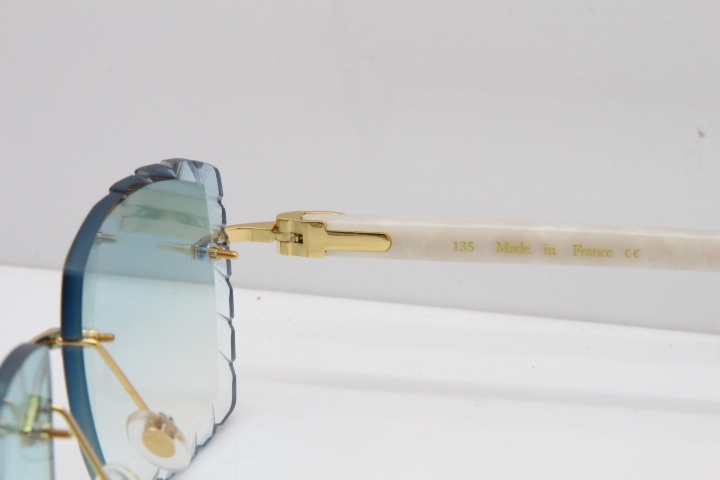 Cartier Rimless Aztec Arms 8300816 Carved Lens Sunglasses In Gold Ice Blue Lens