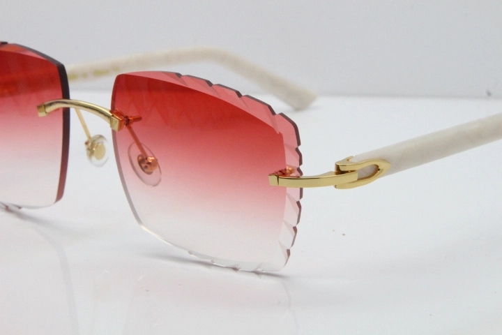 Cartier Rimless Aztec Arms 8300816 Carved Lens Sunglasses In Gold Red Lens