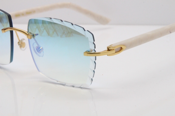 Cartier Rimless Aztec Arms 8300816 Carved Lens Sunglasses In Gold Ice Blue Lens