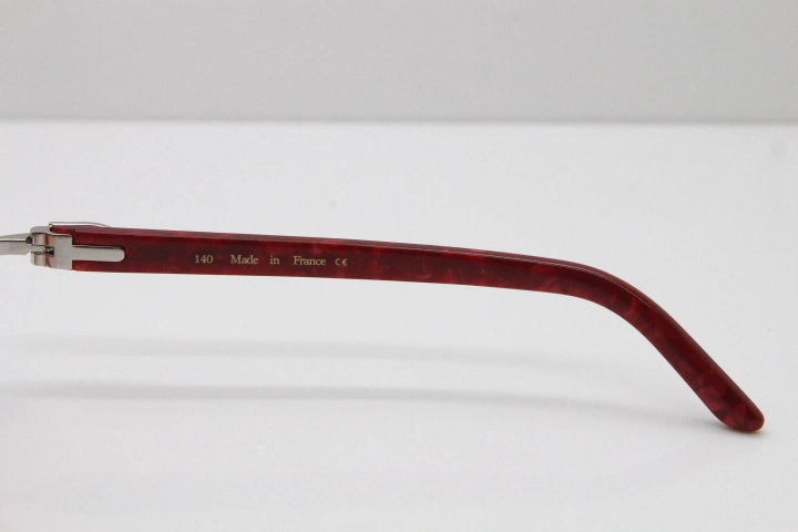 Cartier Rimless 8300816 Marble Red Aztec Arms Sunglasses In Gold Orange Lens