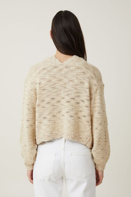 Short spotted knitted cardigan with no buttons and versatile long sleeves