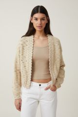 Short spotted knitted cardigan with no buttons and versatile long sleeves