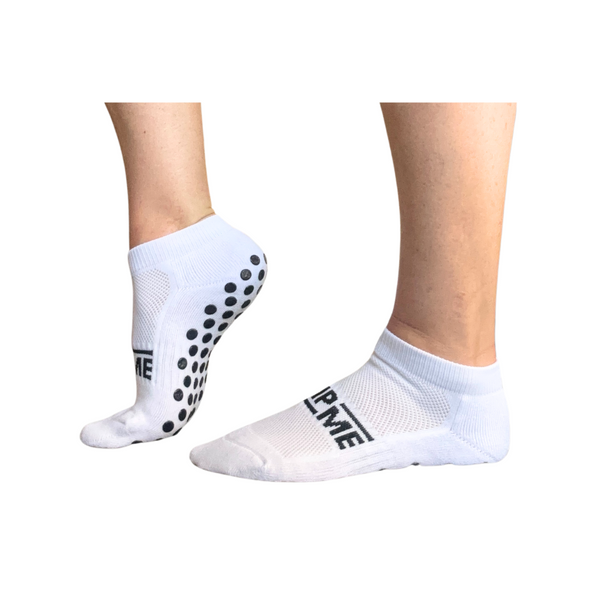 full sole grip socks showing outsole dot coverage across heel and forefoot for consistent traction during indoor movement