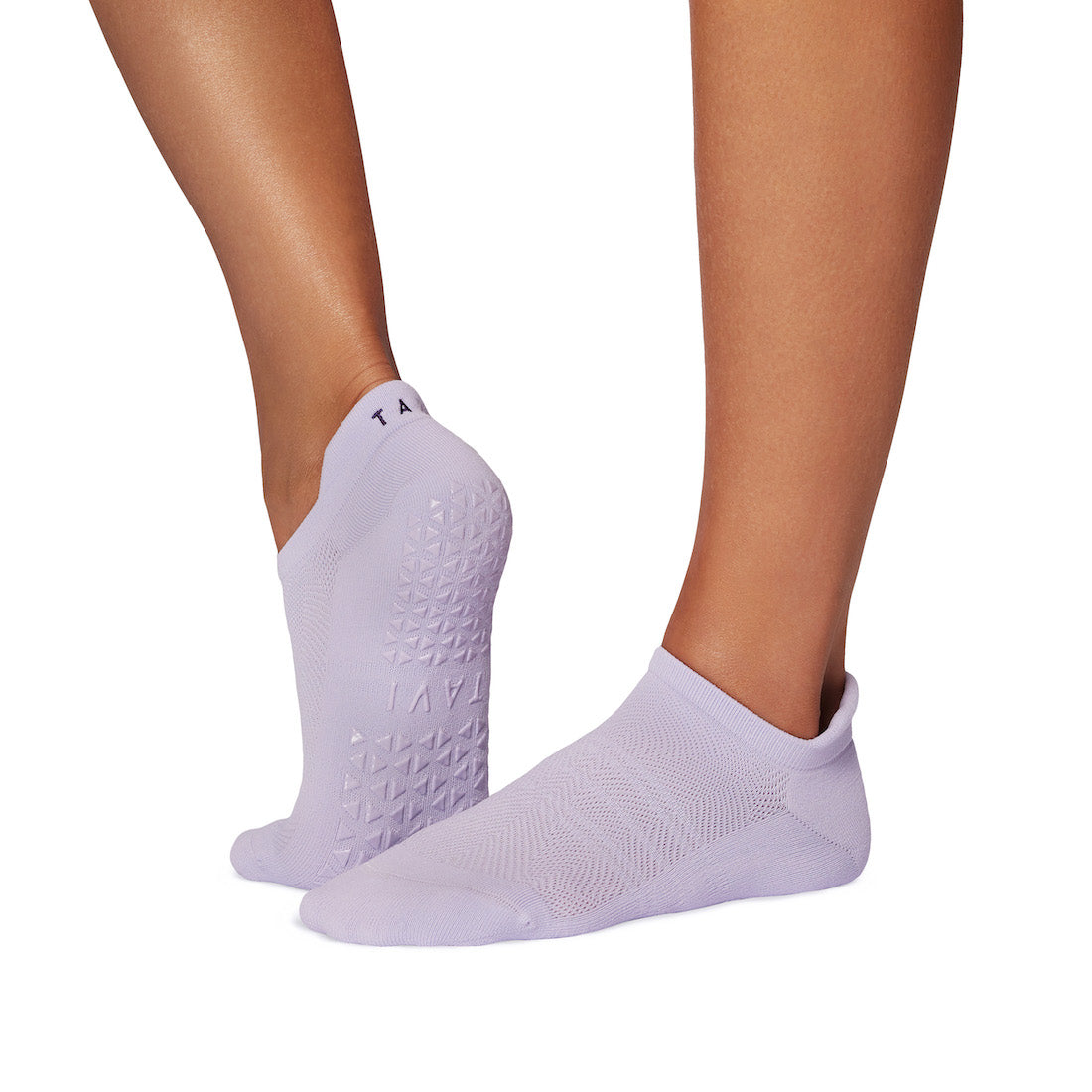 light purple ankle grip socks worn on feet showing textured grip pattern on the sole for smooth indoor floors