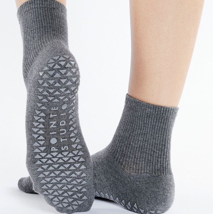 standard grip socks showing full sole grip pattern providing consistent traction during controlled indoor standing and transitions
