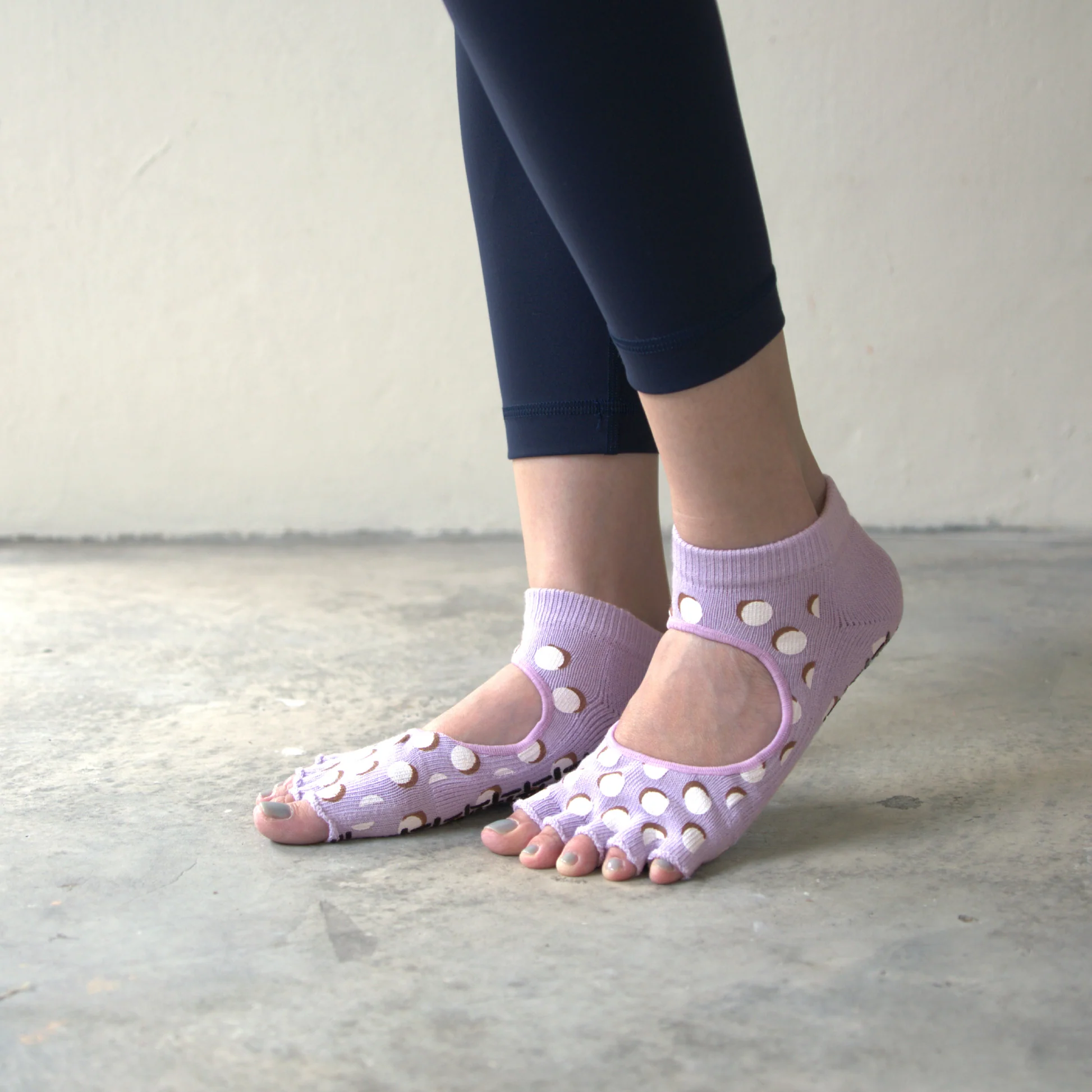 Close-up of lavender open-toe Pilates grip socks with silicone dots for studio and yoga use