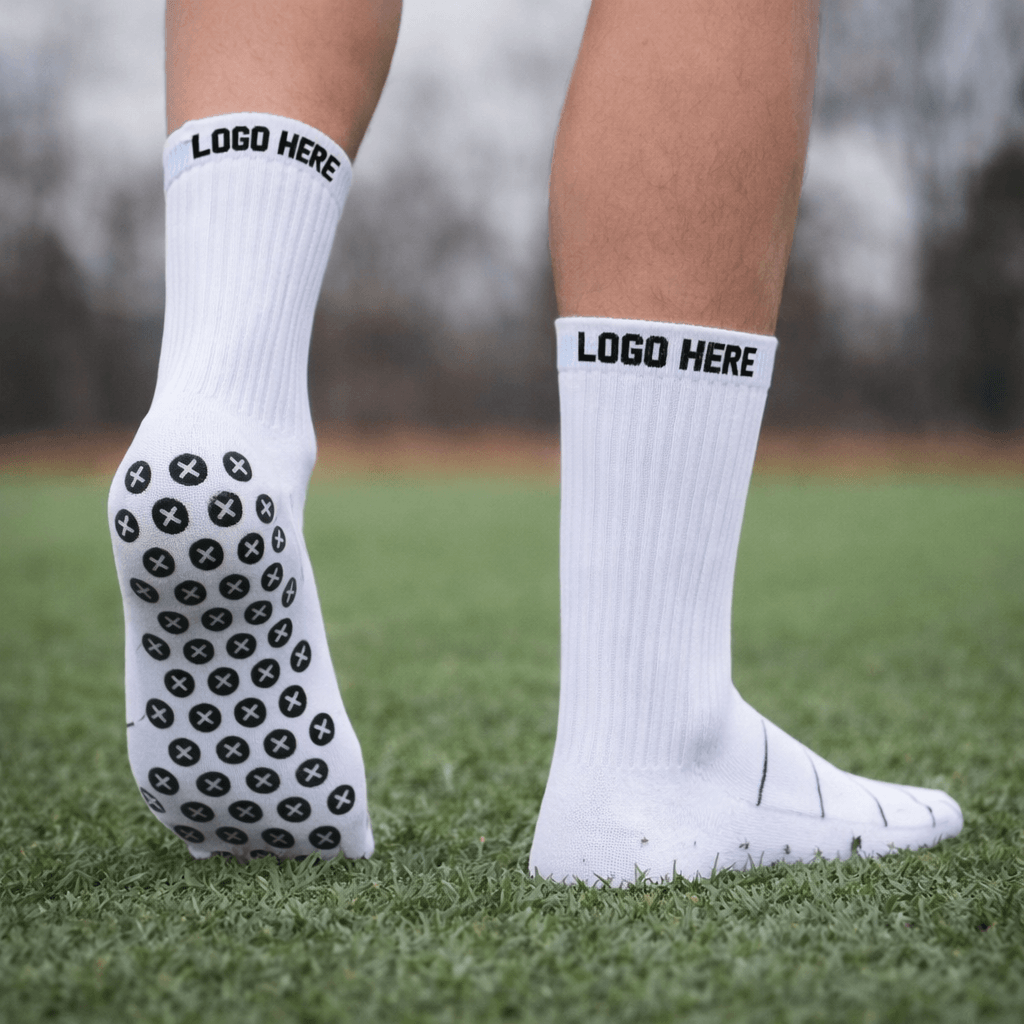 custom grip socks with logo on outdoor grass showing anti slip silicone grip sole