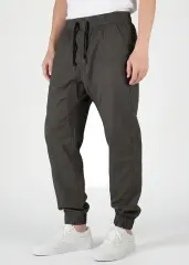 Close-up front view of ItalyMorn men's dark grey green jogger pants, featuring a comfortable elastic waistband with black drawstrings, functional side pockets, and a clean, modern slim fit