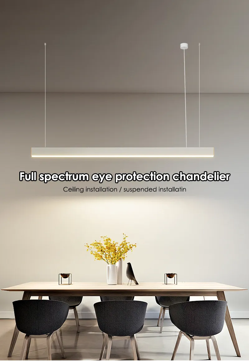 White linear pendant light hung above a dining table