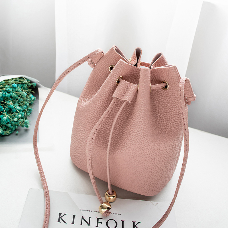 Foreign trade wholesale bucket bag lychee pattern Korean style mobile phone bag spring and summer new shoulder crossbody pull-belt coin purse