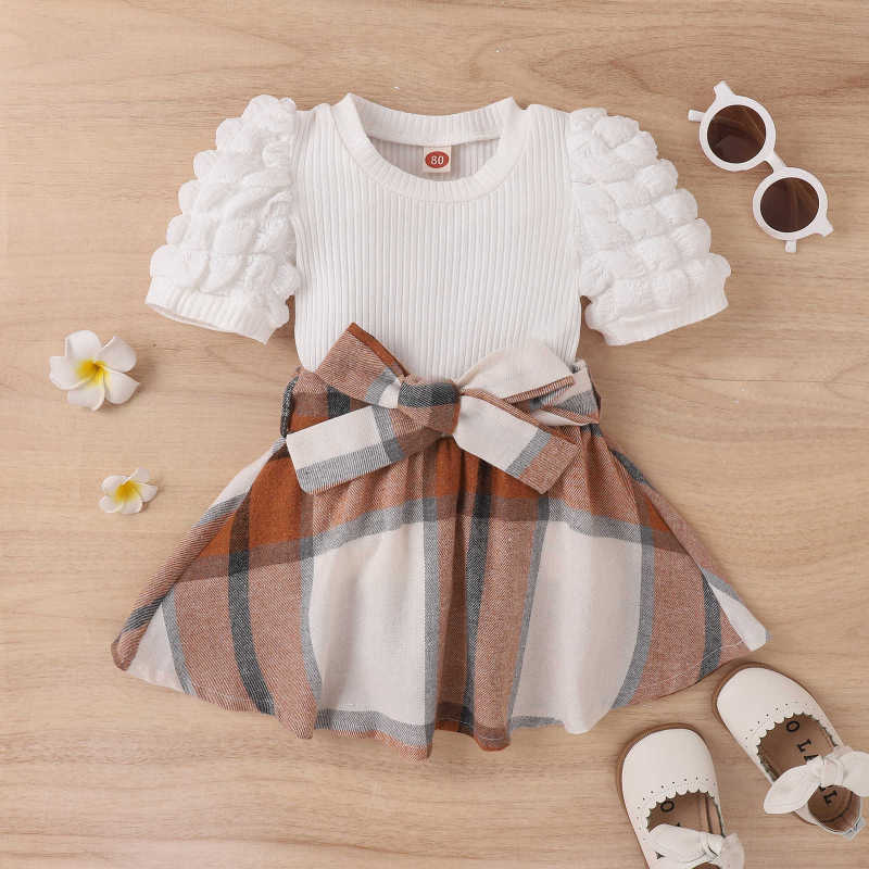 Amazon European and American Spring-Summer new type girls' suit puff sleeve top bow plaid skirt wholesale