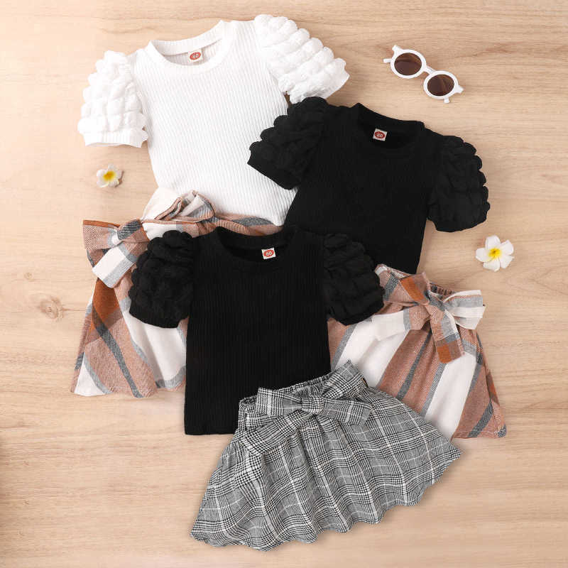 Amazon European and American Spring-Summer new type girls' suit puff sleeve top bow plaid skirt wholesale