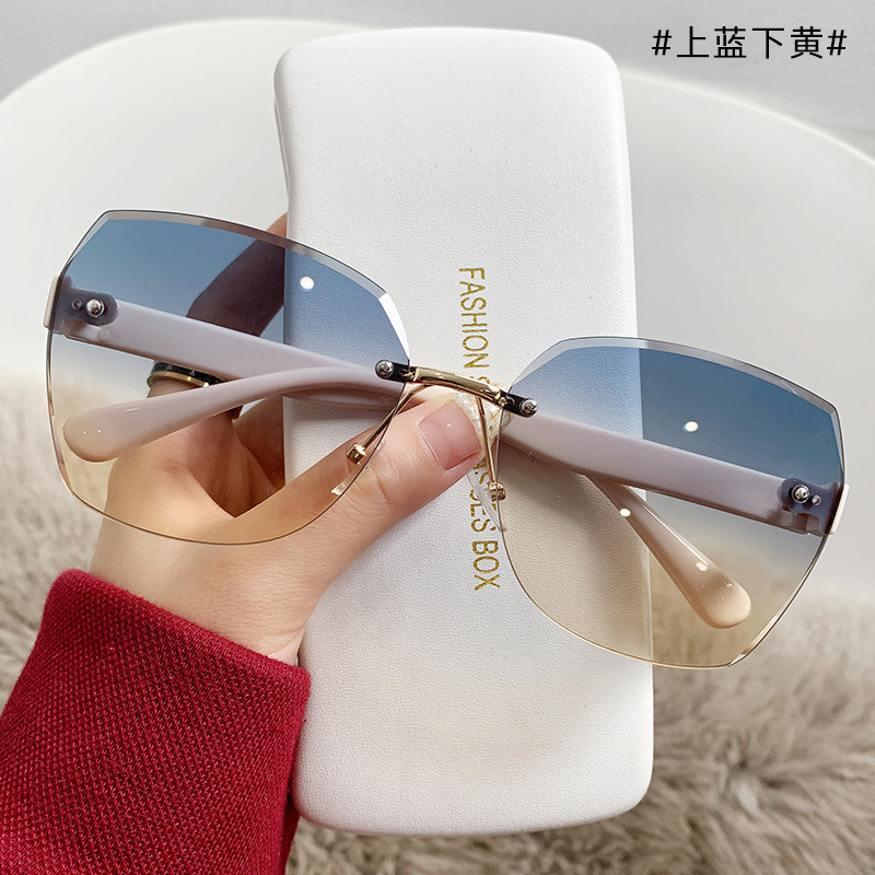 Xiaohongshu fashion frameless trimming sunglasses two-tone gradient beach sunglasses women's large frame windproof driving glasses men