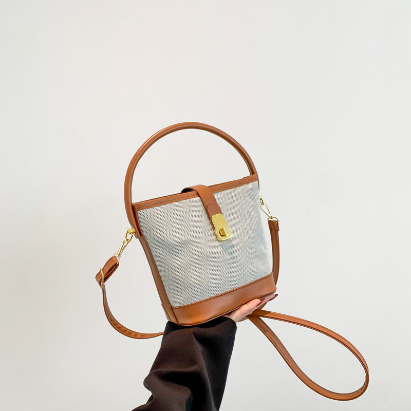 Western style design new color-blocking textured canvas fashion twist lock commuter one-shoulder portable cross body bucket bag