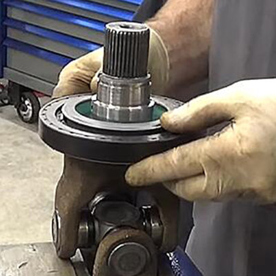 Photo of high performance oil bath seal installed on a commercial semi-trailer axle hub.
