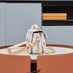 LV x TM Pochette Métis East West