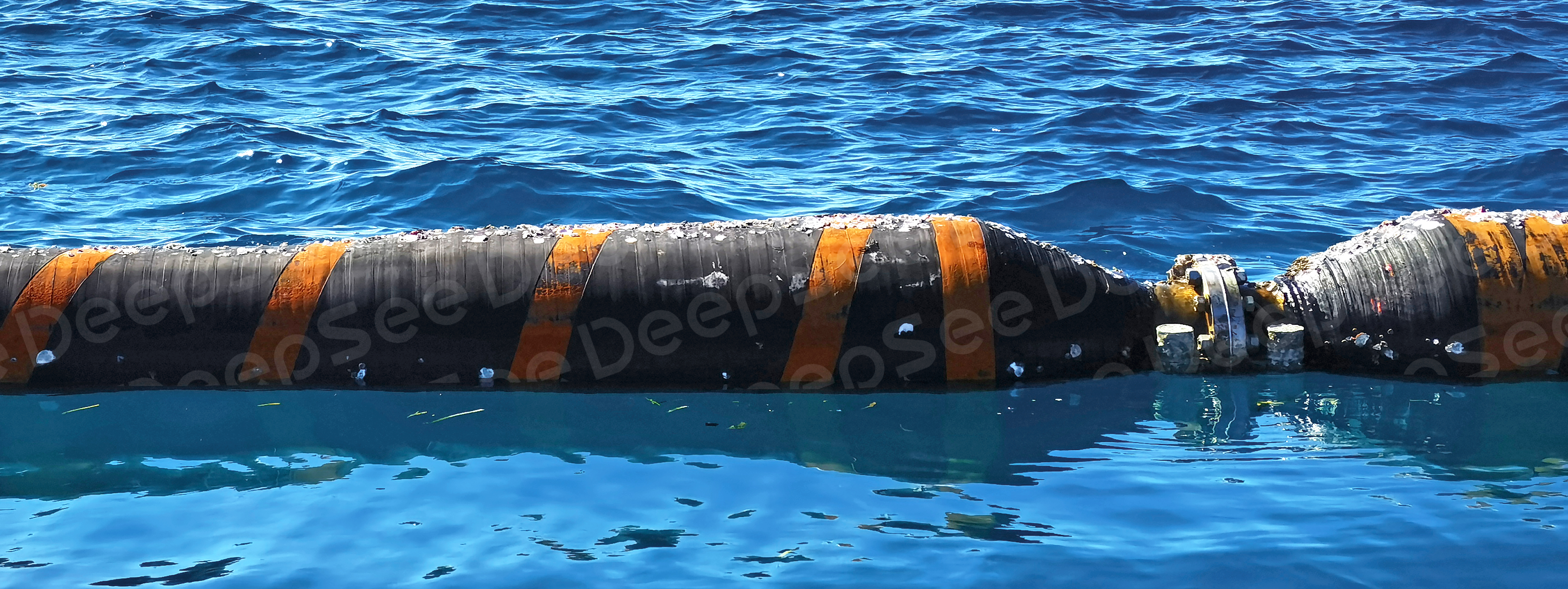 DeepSee floating hoses connected with each other on the sea