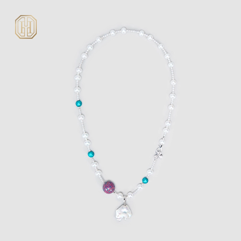 Close view of freshwater pearl necklace and lacquer bead accents
