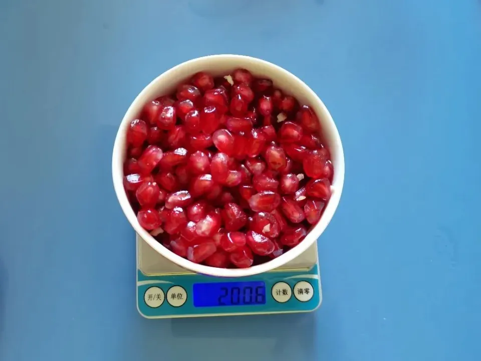 A full small bowl of soft-seeded pomegranate is about 200 grams.