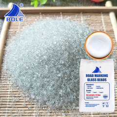 Close-up of AASHTO M247 I Reflective Glass Beads powder, showcasing its fine texture and spherical shape for optimal reflectivity in road marking applications.