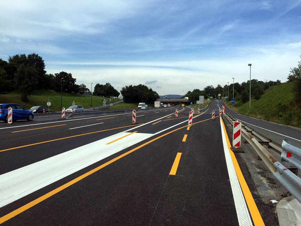Thermoplastic road markings on a highway, providing clear and durable lane demarcation.