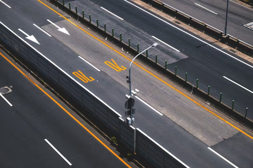 Aerial view of bright, uniform highway markings with consistent retroreflectivity