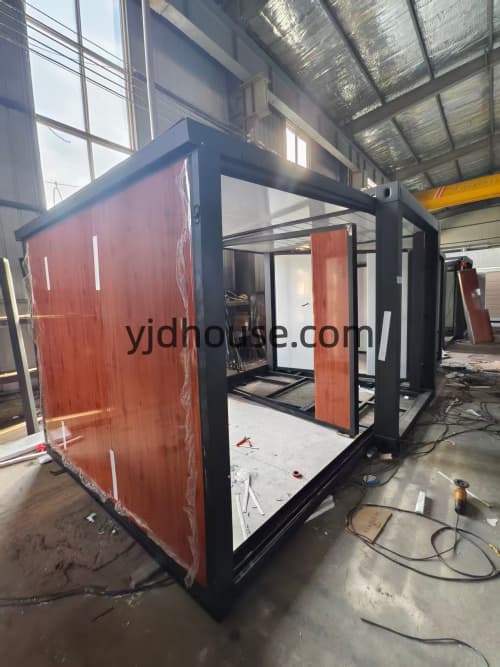 Factory installation of wall panels on a 10ft expandable house