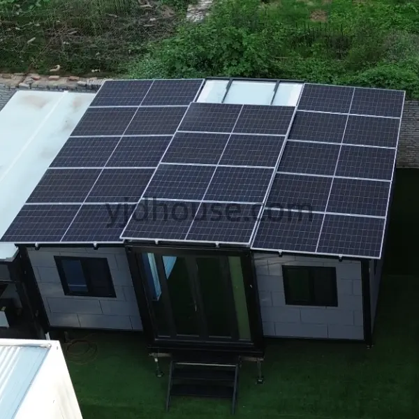Rooftop solar panels installed on an expandable container home