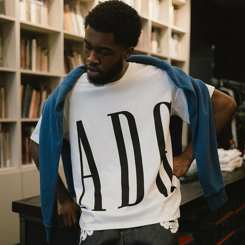 Denim Tears ADG Inc. Tee White Wearing Effect