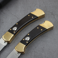 Buck 110/112 AUTO Folding Hunter 3.74" D2 Plain Blade, Ebony Wood Handles, Leather Sheath
