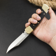 Buck 110 AUTO Elite Folding Hunter 3.74" D2 Plain Blade, Ebony Wood Handles, Black Leather Sheath