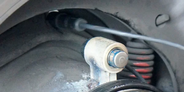 Damaged wheel speed sensor showing one of the five reasons why the ABS light is on
