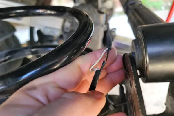 Damaged ABS wiring harness showing one of the five reasons why the ABS light is on
