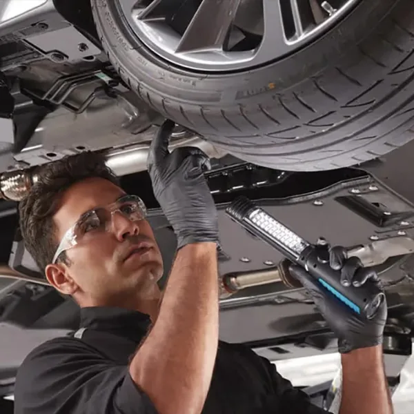 Checking wheel bearing play to identify bad wheel bearing symptoms