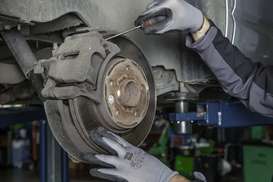 Sanding glazed brake pads: Step-by-step guide to fixing glazed brakes by sanding down the smooth surface to restore braking performance.