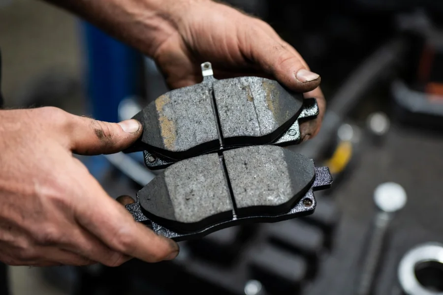 Close-up of worn brake pads, highlighting common brake problems like squealing and vibration.