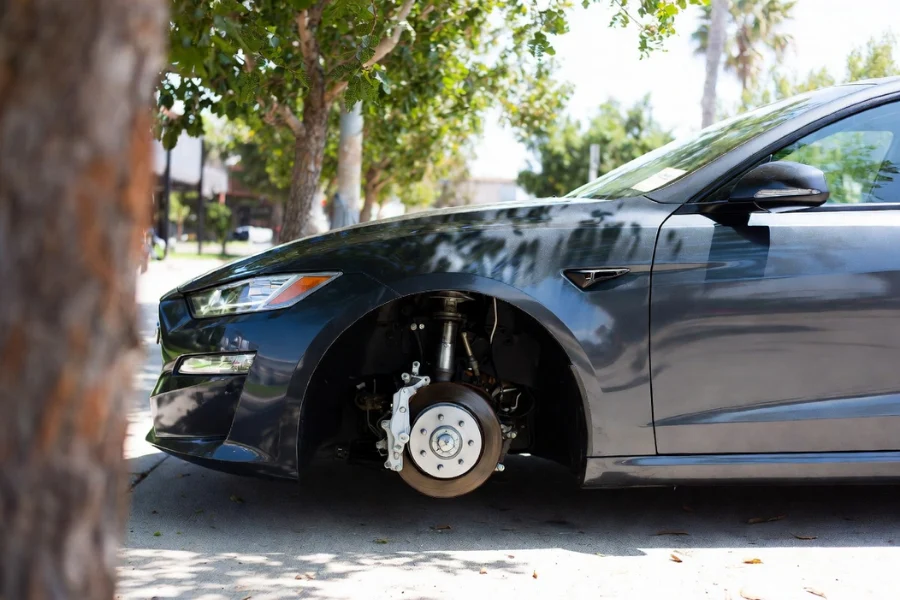 Preparing your wheels for cleaning by parking in a shaded area to cool them down before cleaning brake dust.