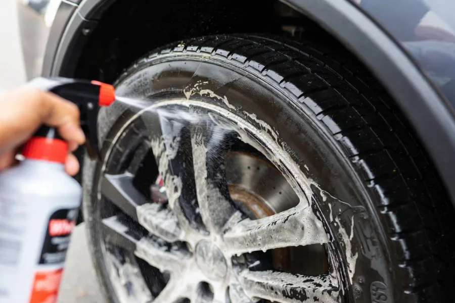 Applying wheel cleaner to remove brake dust from rims – key step in cleaning brake dust off your wheels.