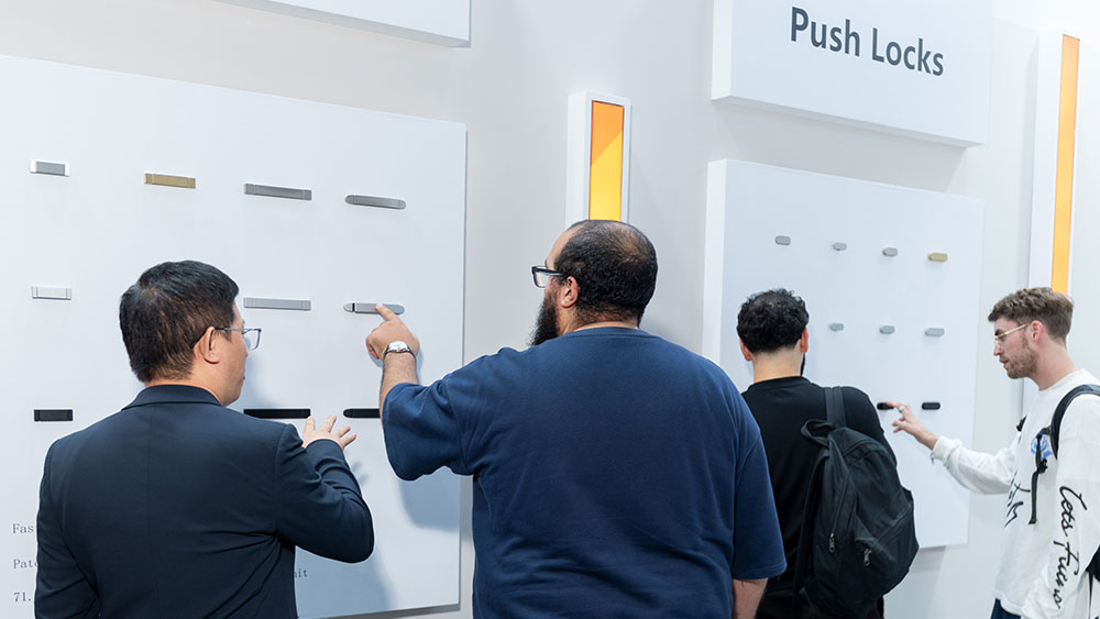 RV hardware product presentation and customer interaction at Caravan Salon Düsseldorf