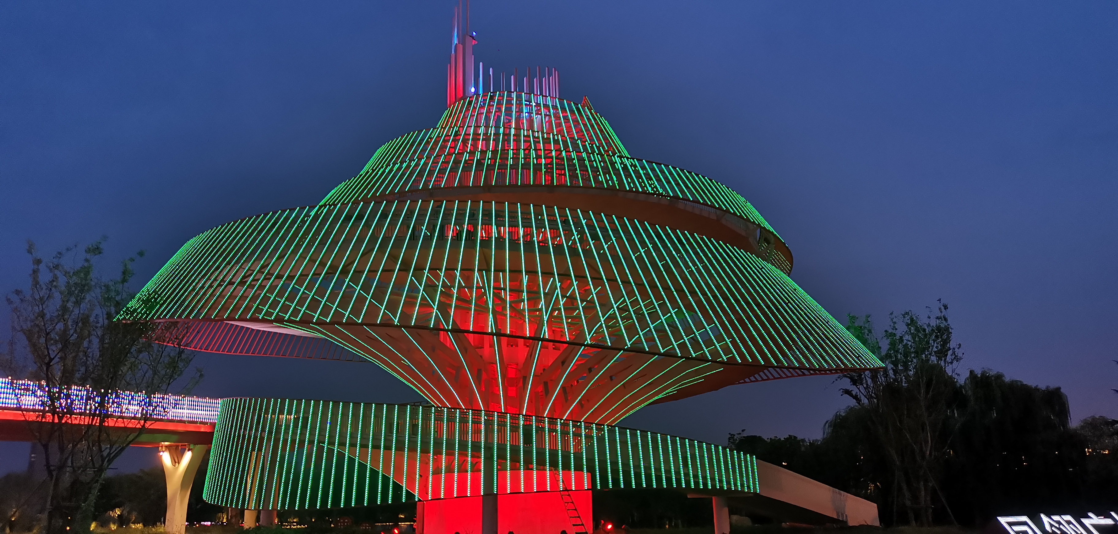 Illuminated landmark tower with LED linear lighting at night