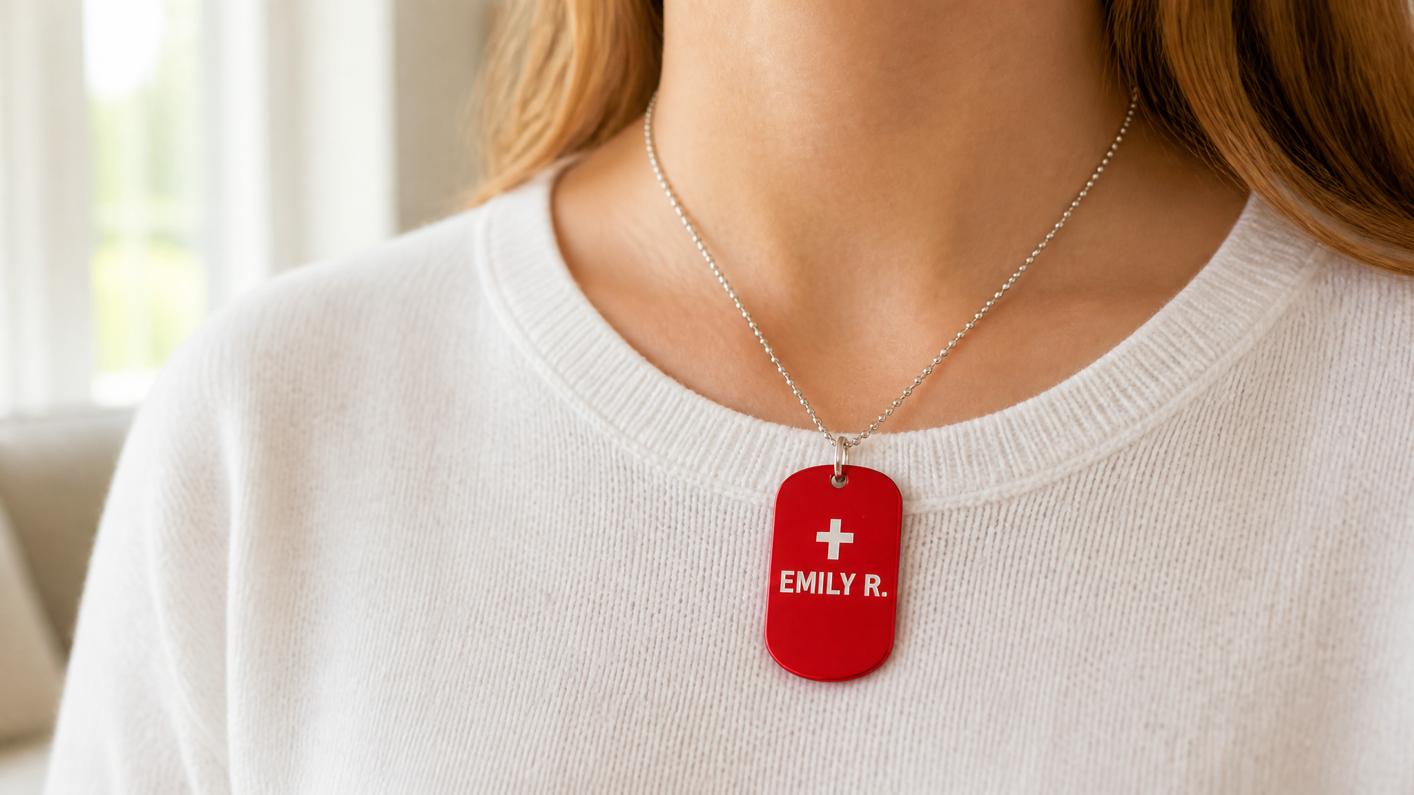 Red anodized ID tag worn as necklace