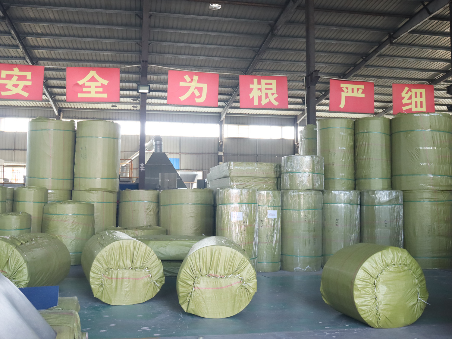 Finished rolls neatly stacked in the QT MAT factory