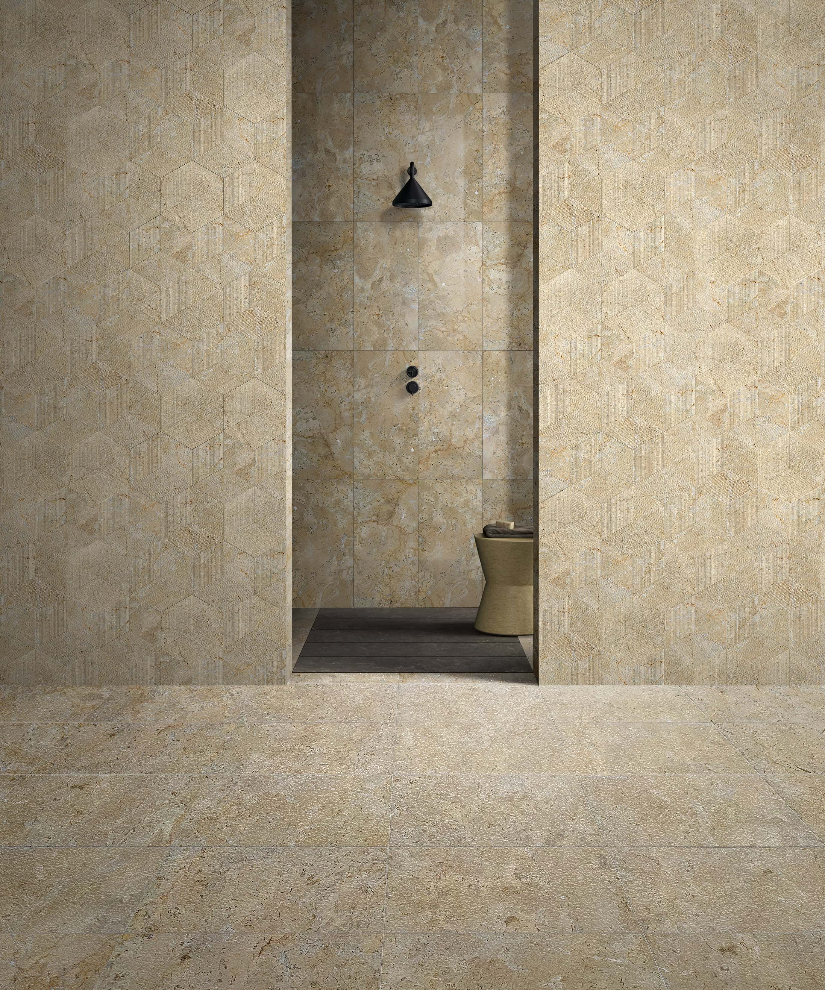 Luxury bathroom design showcasing a mix of Hyatt Gold natural marble: 12x24 leather finished floor, polished center wall, and hexagon FS textured side walls.