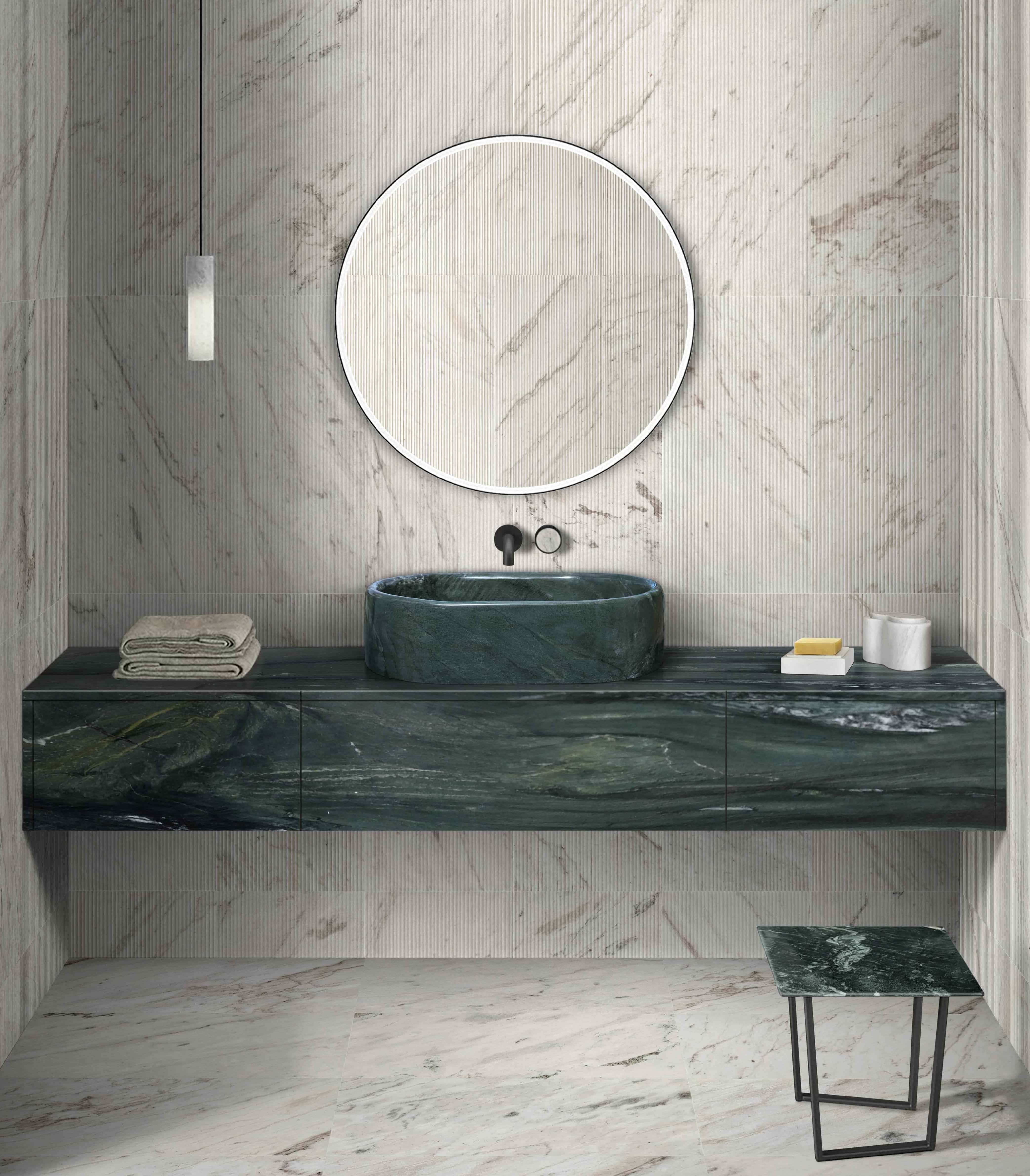 Striking bathroom design featuring a Diamond Green solid marble sink paired with a premium Snow Mountain White 3D textured marble wall.