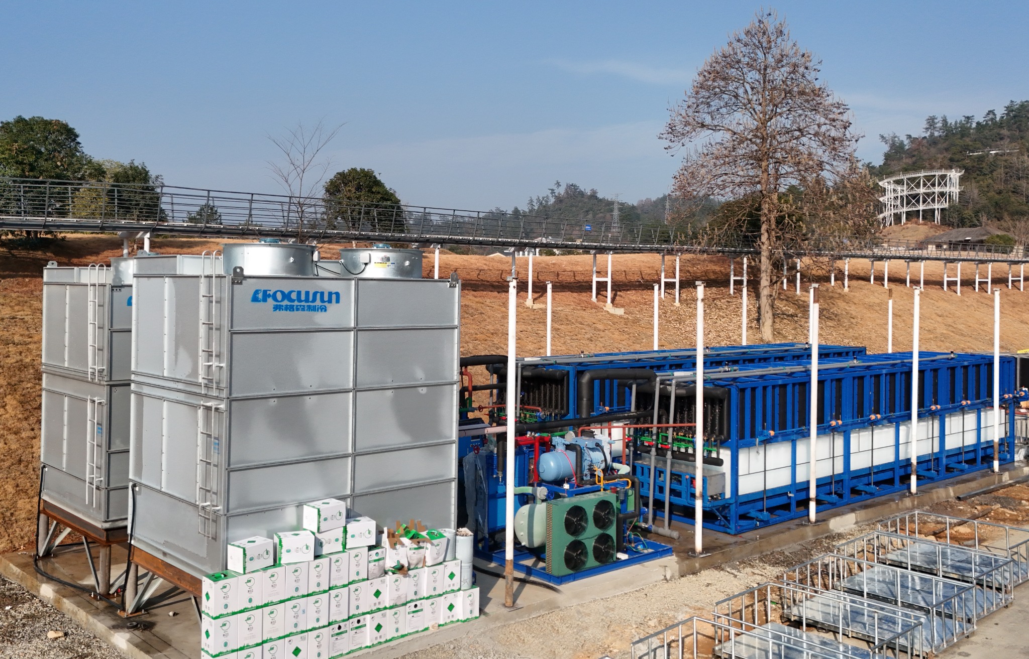 Industrial concrete cooling project utilizing an integrated flake ice plant and chilled water system to regulate thermal mix temperatures.