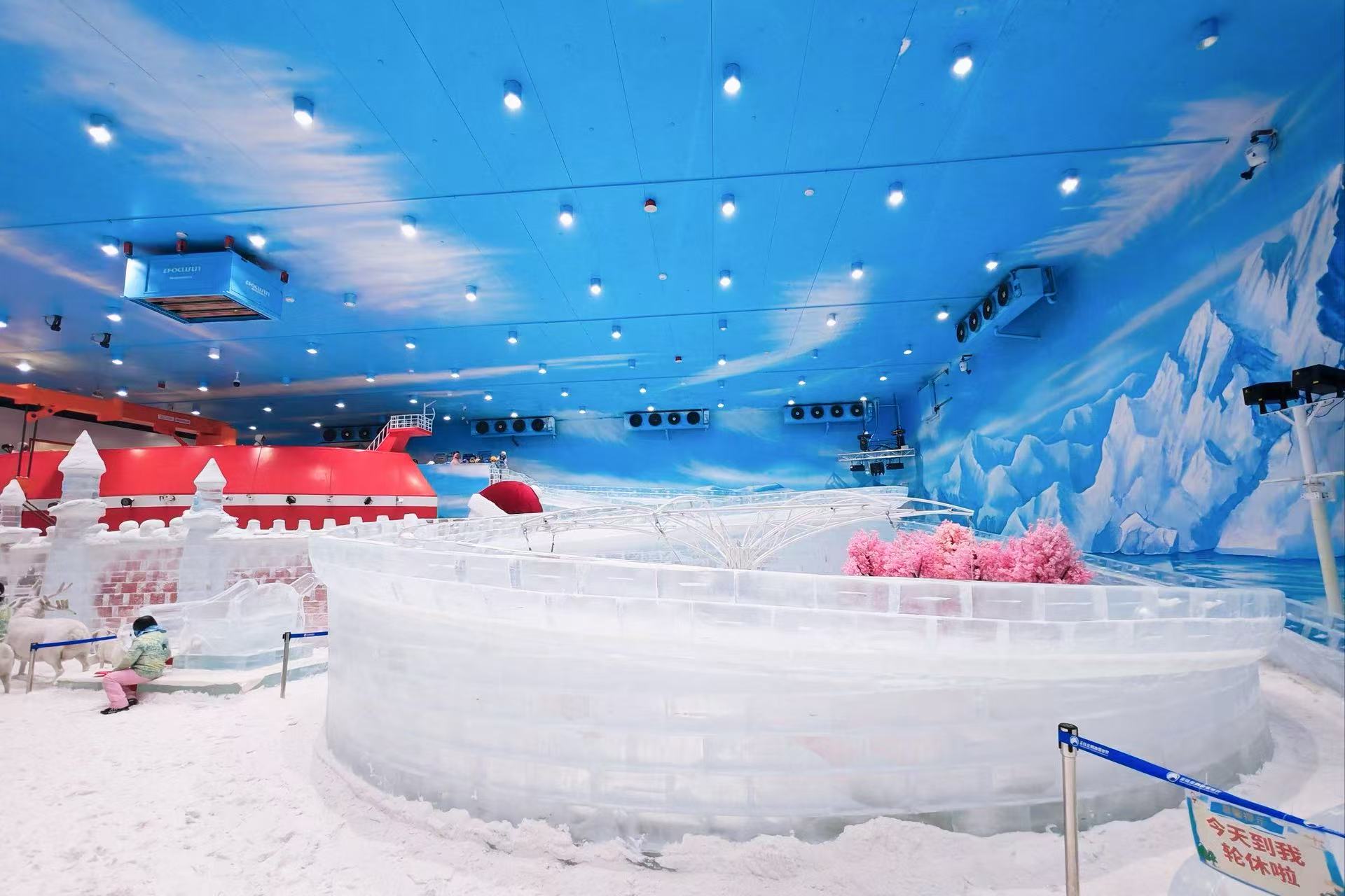 Ceiling-mounted commercial snow falling machine generating a gentle and continuous natural drift of real snow for retail mall winter attractions.
