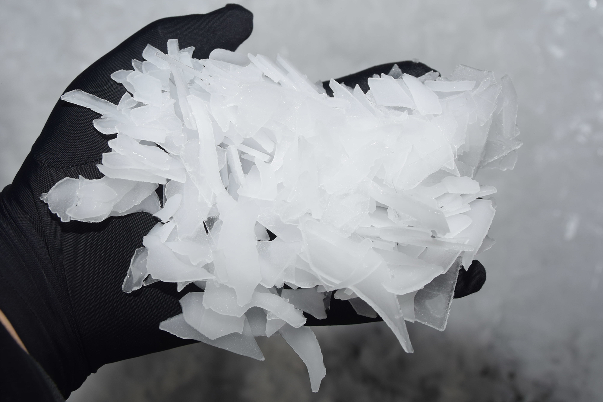 Close-up of dry, thin, uniform flake ice produce for fresh fish presevration.