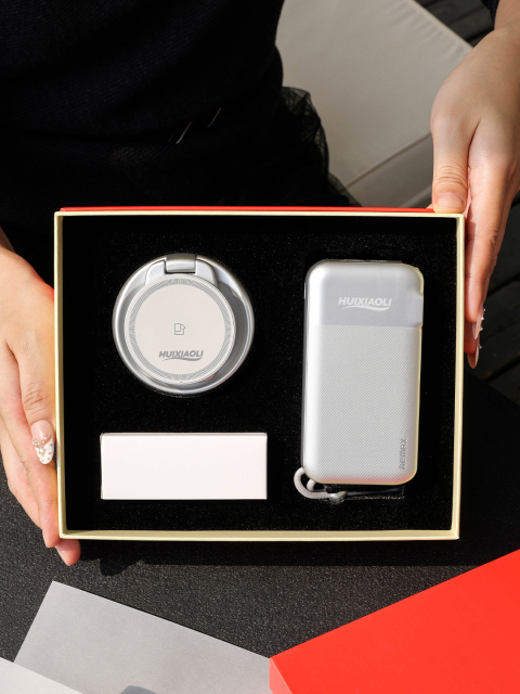 Round foldable wireless charger and silver power bank in a fitted gift box