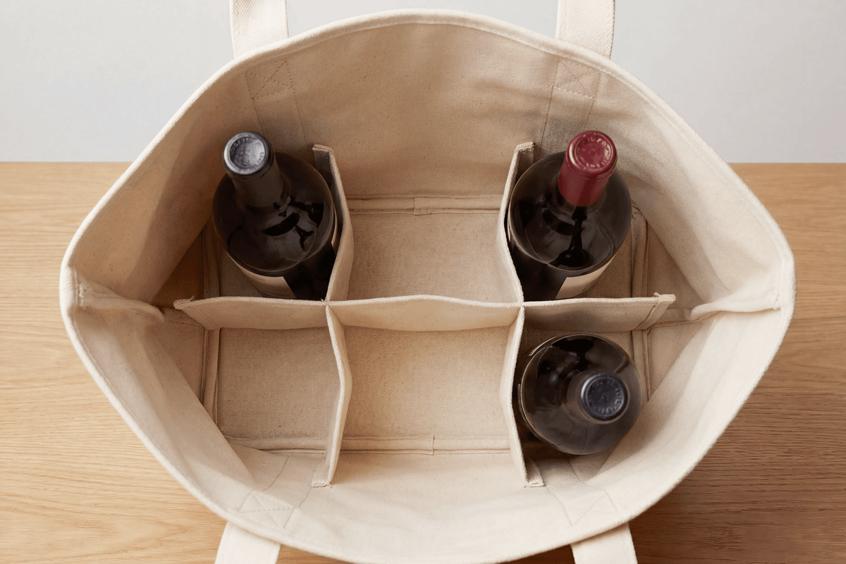 Modular Collapsible Divider Tote Interior Top-down view of tote bag interior showing collapsible divider folded flat